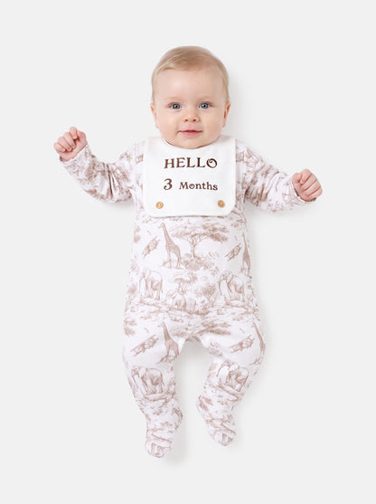 "Hello 1,3,6,12 Months" Embroidered Baby Grow with Attached Small Bib - Safari Collection - Beige