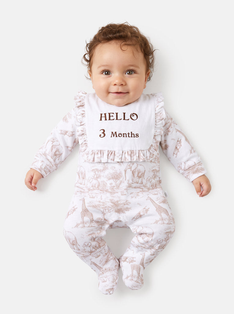 "Hello 1,3,6,12 Months" Embroidered Baby Grow with Frilled Bib - Safari Collection - Beige