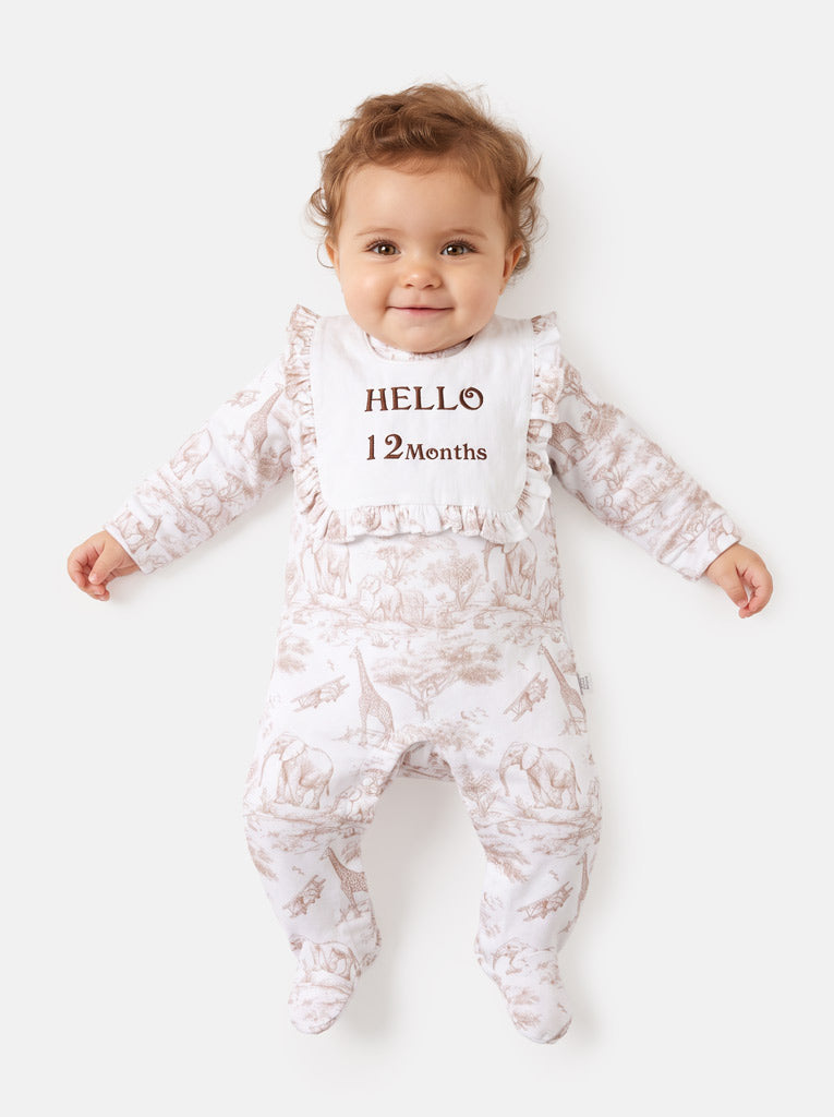 "Hello 1,3,6,12 Months" Embroidered Baby Grow with Frilled Bib - Safari Collection - Beige